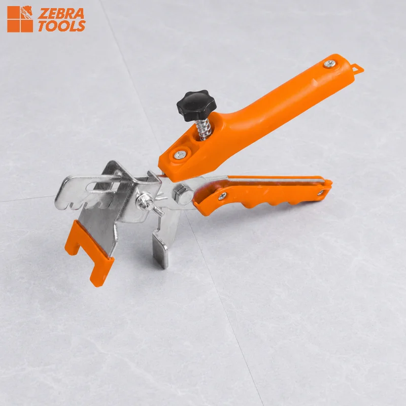 Tile pliers in use — breaking off clip below tile surface, clean finish